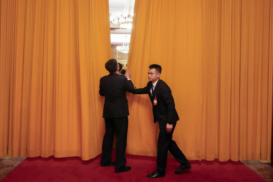 Officials close a curtain during a meeting between U.S. Secretary of State Antony Blinken and Chinese President Xi Jinping at the Great Hall of the People, Friday, April 26, 2024, in Beijing, China. (AP Photo/Mark Schiefelbein, Pool)