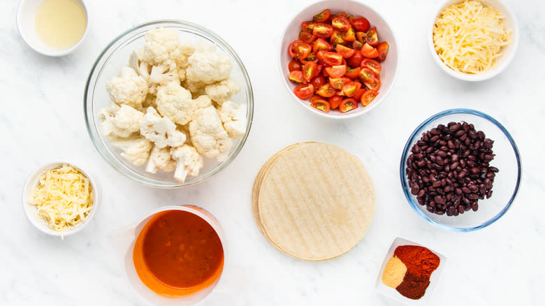 Cauliflower enchilada ingredients in bowls