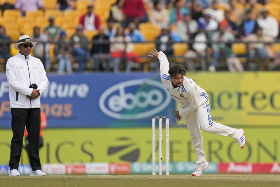 India's Kuldeep Yadav bowls on the first day of the fifth and final test match between England and India in Dharamshala, India, Thursday, March 7, 2024. (AP Photo/Ashwini Bhatia)