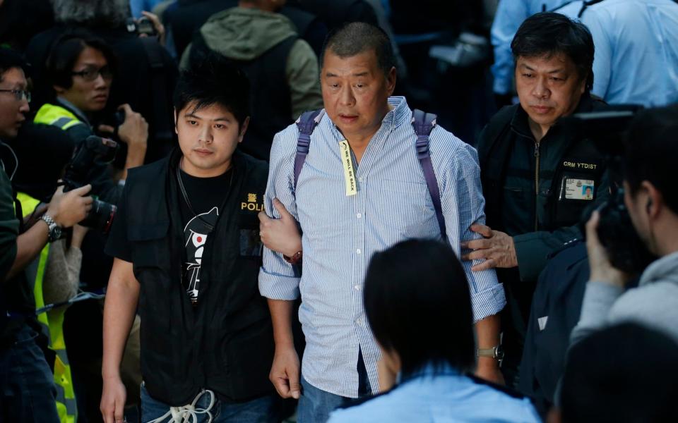 Hong Kong media magnate Jimmy Lai, when he was arrested in 2014 - P