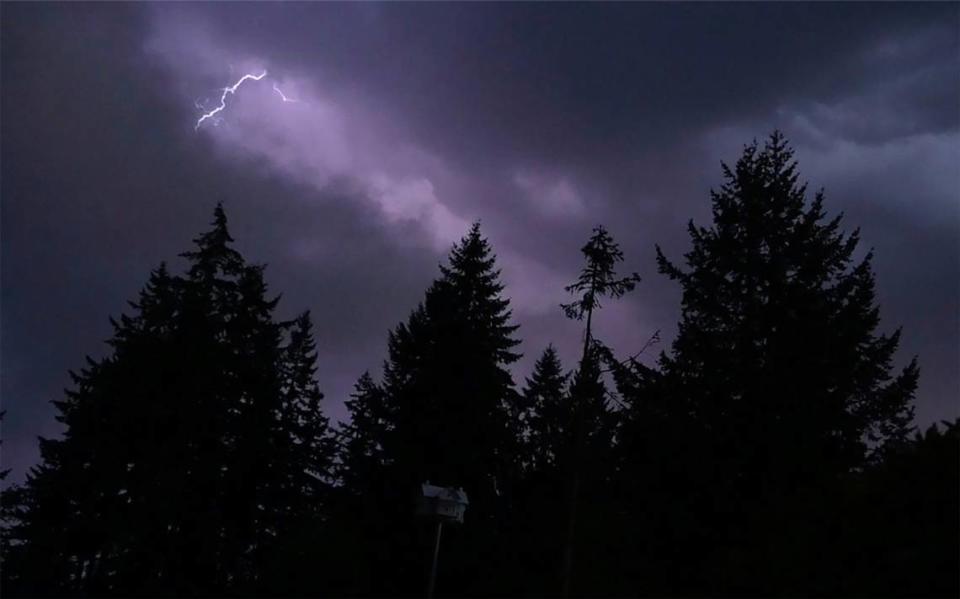 A lightning flash can be seen over Rainier early Tuesday morning.