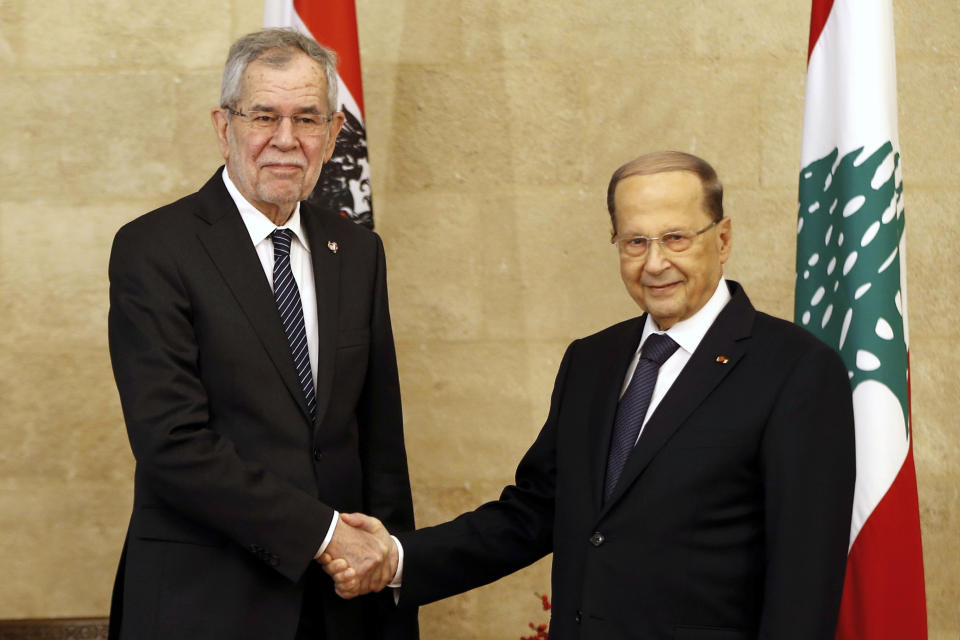 Lebanese President Michel Aoun, right, shakes hands with his Austrian counterpart Alexander Van Der Bellen, at the Presidential Palace in Baabda, east of Beirut, Lebanon, Tuesday, Dec. 11, 2018. (AP Photo/Bilal Hussein)