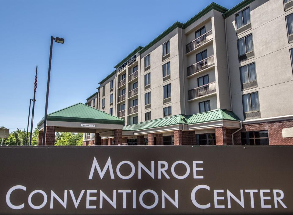 The Monroe Convention Center sign is seen with the neighboring Courtyard by Marriott hotel in the background along South College Avenue.