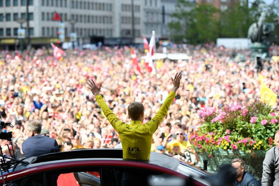 Jonas Vingegaard waves to the huge crowd in Copenhagen