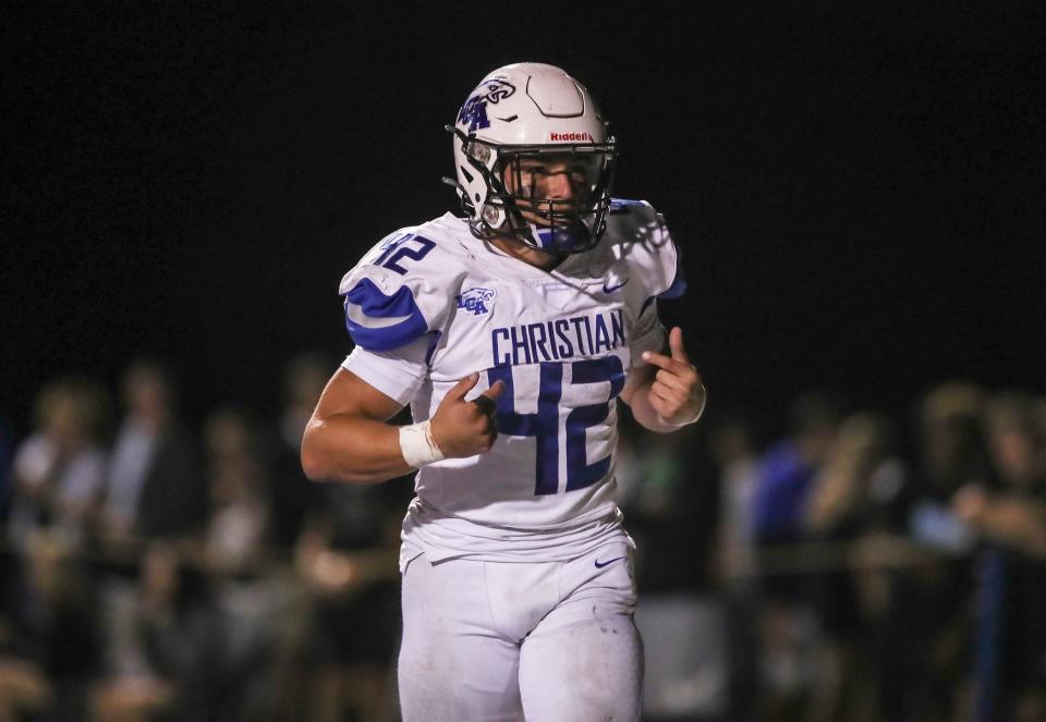 Lexington Christian's Brady Hensley points to his jersey and says "Lexington Christian" after scoring the Eagles' second touchdown over Christian Academy of Louisville Friday evening. Sept. 8, 2023.