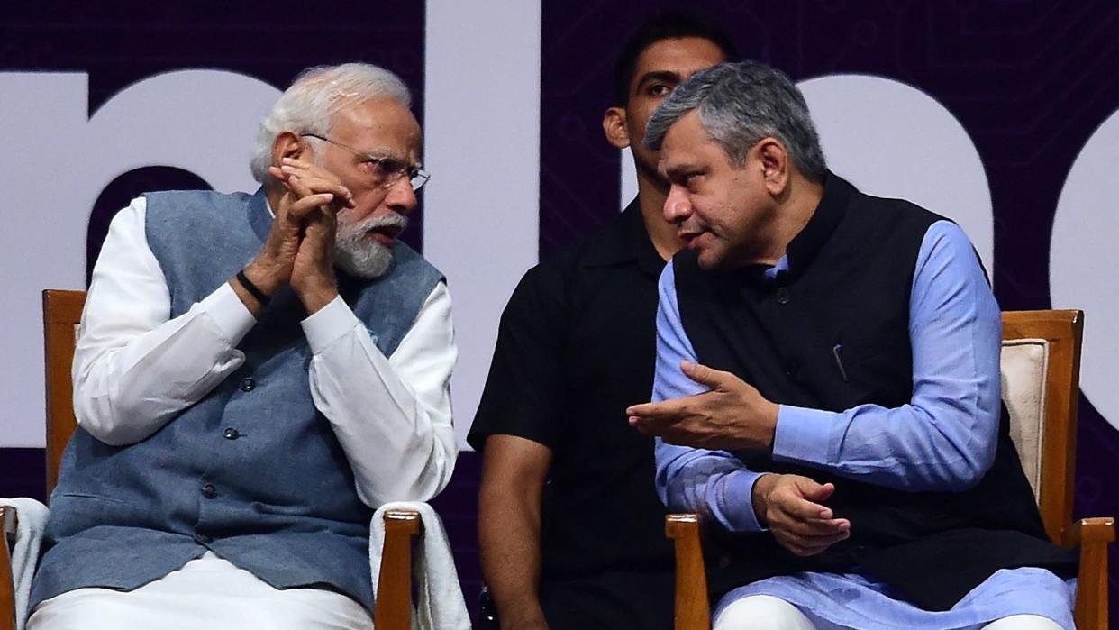  Indian Prime Minister Narendra Modi talks with Minister for Information Technology Ashwini Vaishnaw during SemiconIndia 2023, at Mahatma Mandir in Gandhinagar on July 28, 2023.  