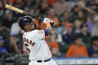 Houston Astros' Martin Maldonado watches his three-run home run against the Texas Rangers during the second inning of a baseball game Thursday, Aug. 11, 2022, in Houston. (AP Photo/David J. Phillip)