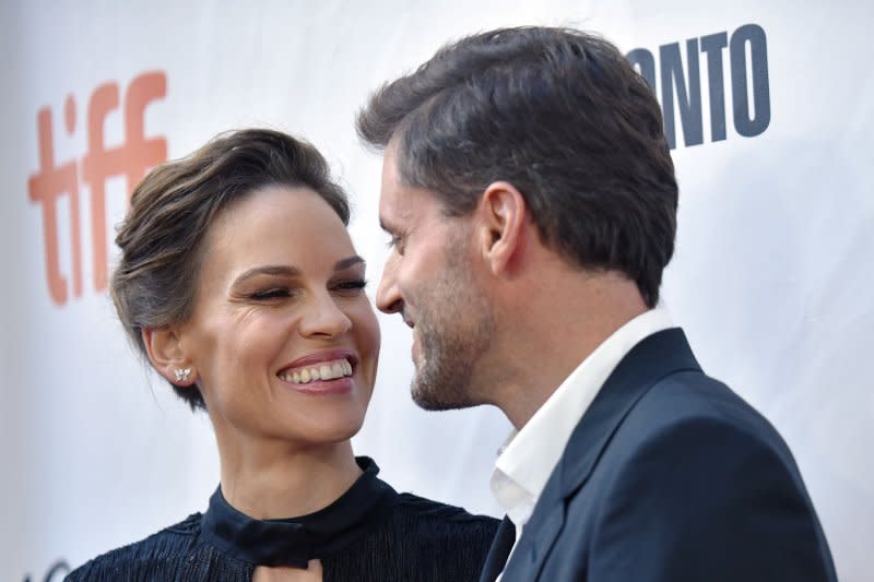 Hilary Swank (L) and Philip Schneider attend the Toronto International Film Festival premiere of "What They Had" in 2018. File Photo by Christine Chew/UPI