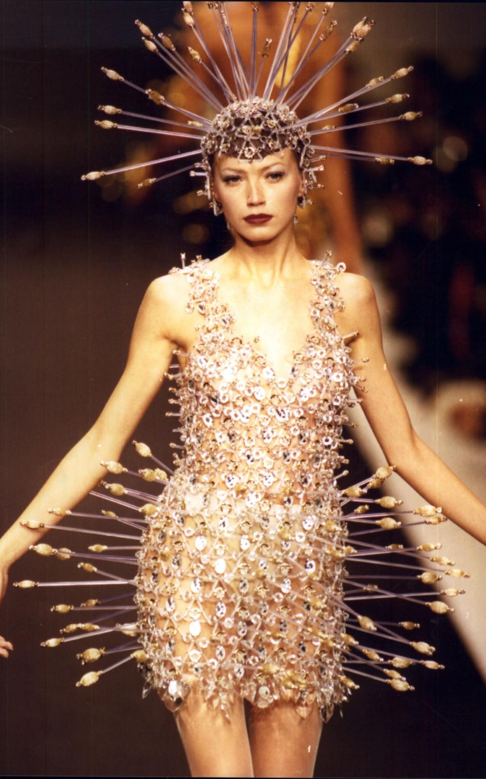 The original incarnation of the Paco Rabanne piece, being modelled on the Paris catwalk in 1996