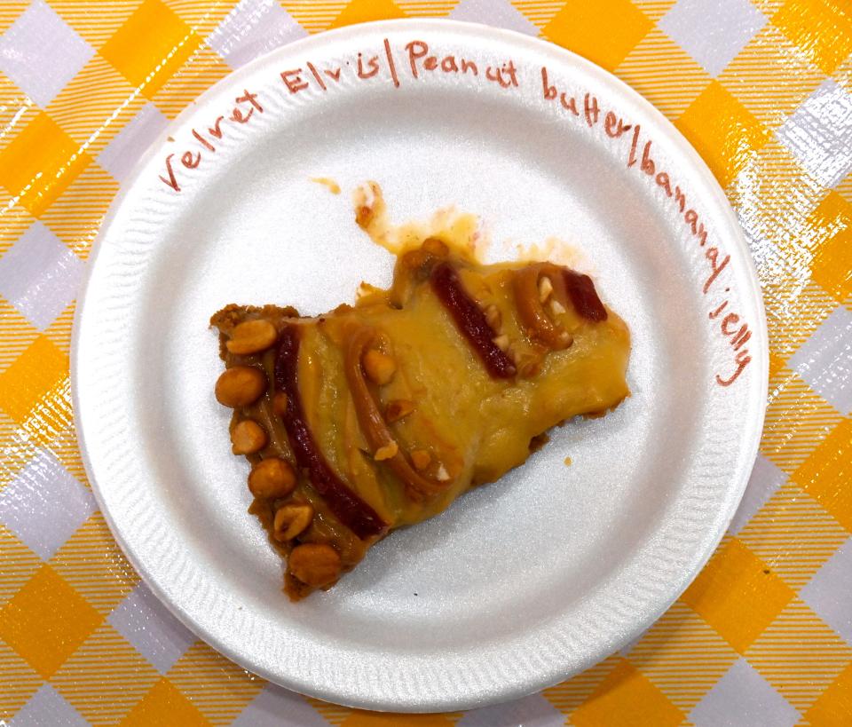 A slice of Velvet Elvis, a peanut butter, banana and jelly pie, sits on the pie buffet table at Saturday’s Pie Fest in Cisco.