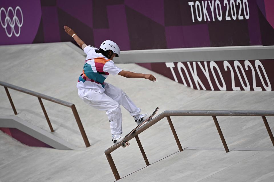 Japan's Momiji Nishiya grinds a rail during the skateboarding women's street final of the Tokyo 2020 Olympic Games at Ariake Sports Park in Tokyo on July 26, 2021.