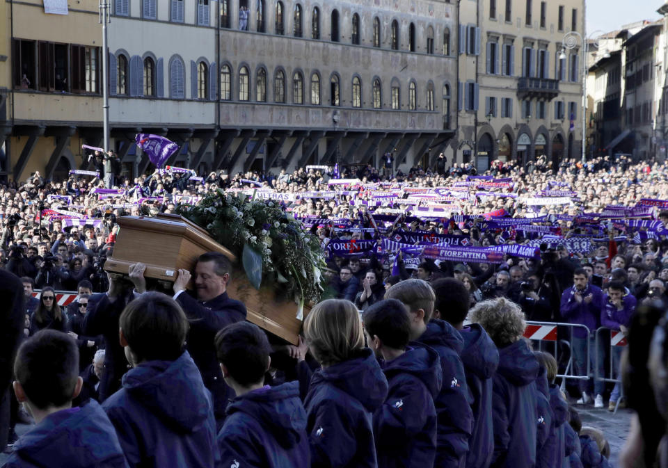 <p>The coffin is carried into the church during the funeral ceremony of Italian player Davide Astori in Florence, Italy, Thursday, March 8, 2018. The 31-year-old Astori was found dead in his hotel room on Sunday after a suspected cardiac arrest before his team was set to play an Italian league match at Udinese. (AP Photo/Alessandra Tarantino) </p>
