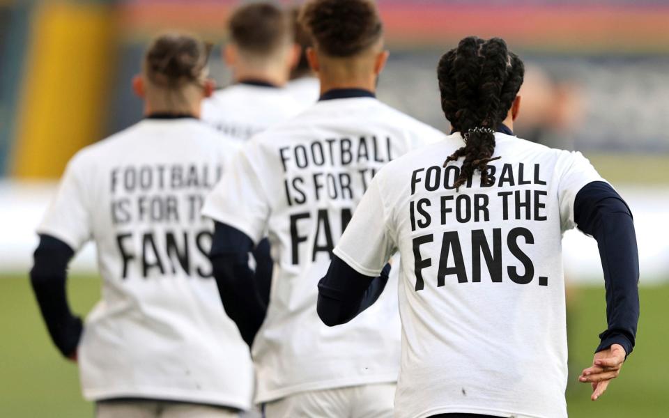 Leeds United players wear protest T-shirts ahead of their match against Liverpool at Elland Road - Getty