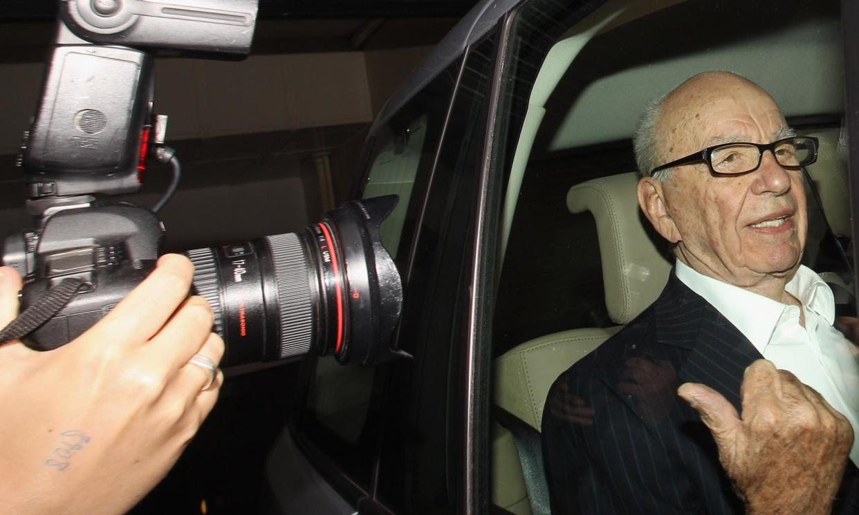 <span>Rupert Murdoch leaving his London flat at the height of the phone-hacking scandal in 2011.</span><span>Photograph: Oli Scarff/Getty Images</span>