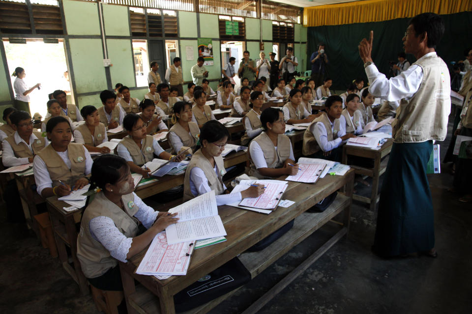 In this photo taken on March 20, 2014, teachers of basic education receive a training for nationwide census at a school in Kyaung Gone township, Myanmar. As Myanmar continues its transition from decades of military rule and self-imposed isolation, it is about to carry out a census that experts say is crucial for national planning and development, but also likely to inflame already soaring ethnic and religious tensions. (AP Photo/Khin Maung Win)