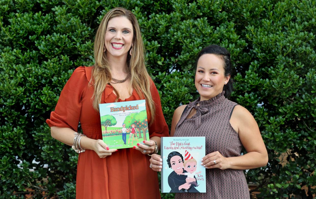 Jennifer Fredell, left, and fellow author Kim Lewis pose with their books during their book tour stop at the Mauney Memorial Library in Kings Mountain Friday morning, Aug. 5, 2022.