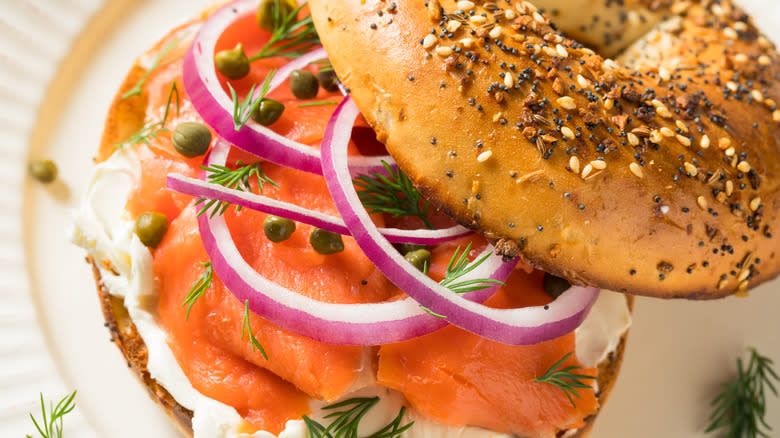 Lox bagel with cream cheese, onions, and capers