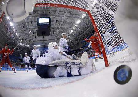 Ice Hockey – Pyeongchang 2018 Winter Olympics – Men Preliminary Round Match – Olympic Athletes from Russia v Slovenia - Gangneung Hockey Centre, Gangneung, South Korea – February 16, 2018 - Luka Gracnar of Slovenia reacts after Ilya Kablukov, an Olympic Athlete from Russia, scores a goal. REUTERS/Julio Cortez/Pool