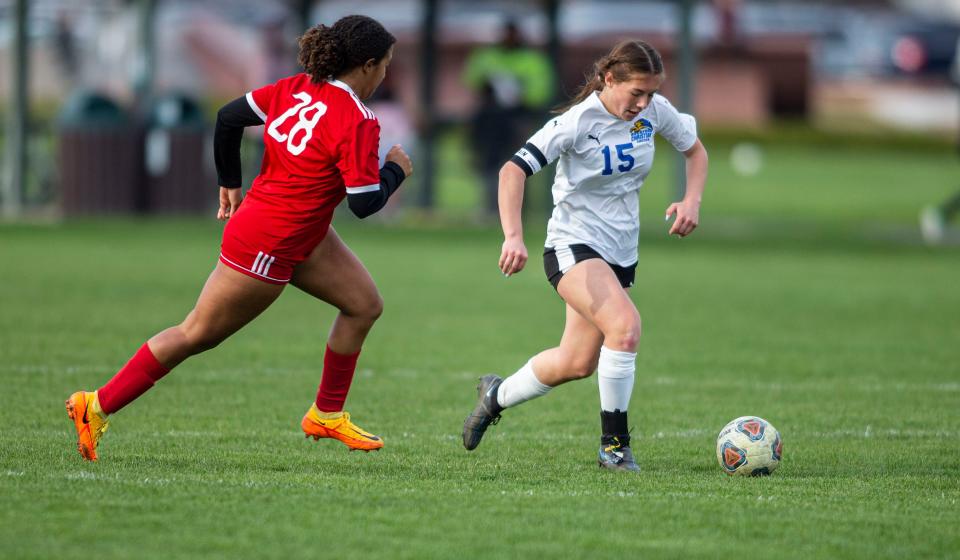 Rockford Christian's Ellen Love takes control of the ball against Oregon on Wednesday, April 27, 2022, at Oregon High School in Oregon .