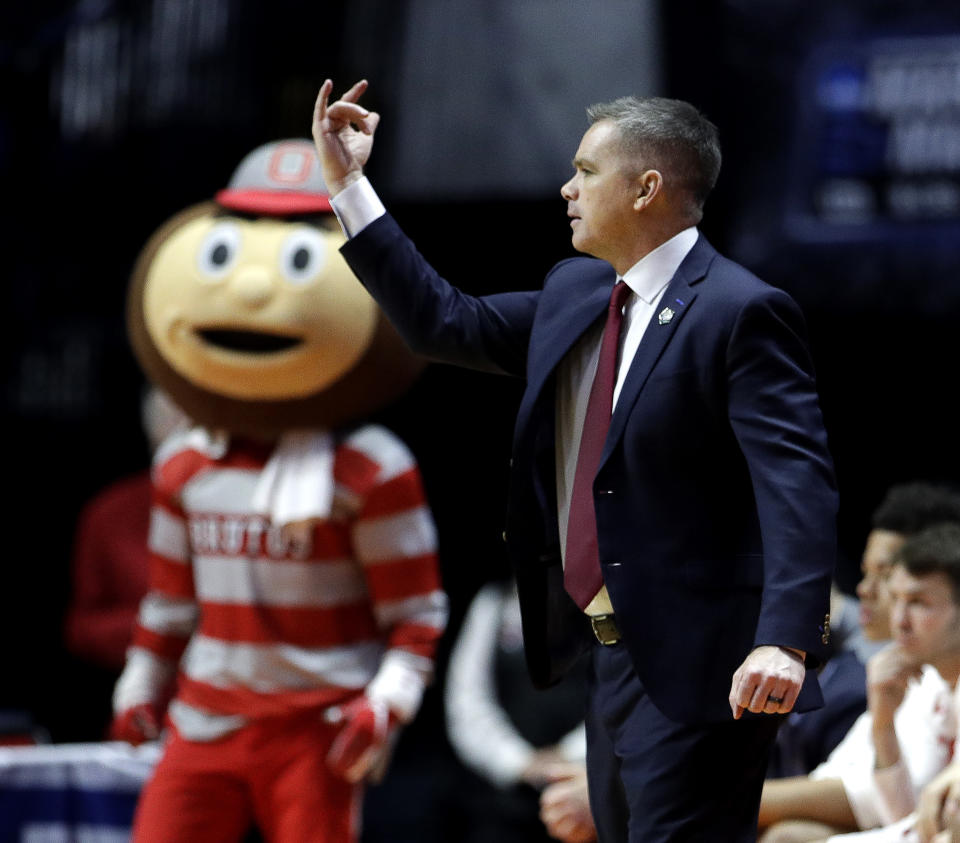 Ohio State head coach Chris Holtmann motions to his players during the second half of a first round men's college basketball game against Iowa State in the NCAA Tournament Friday, March 22, 2019, in Tulsa, Okla. Ohio State won 62-59. (AP Photo/Charlie Riedel)