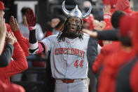 Cincinnati Reds' Elly De La Cruz (44) celebrates in the dugout with teammates after hitting a three-run home run during the third inning of a baseball game against the Chicago White Sox Friday, April 12, 2024, in Chicago. (AP Photo/Paul Beaty)