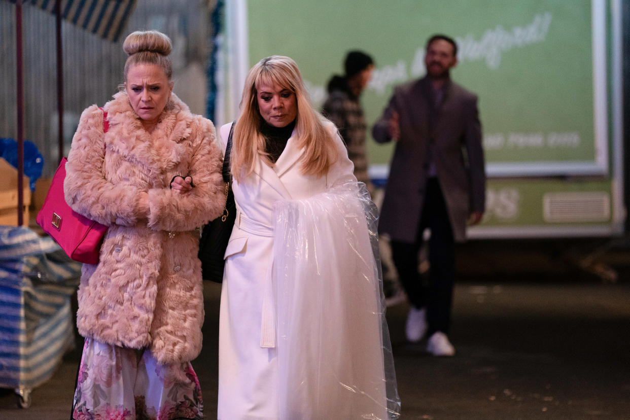  Sharon Watts and Linda Carter collect her wedding dress. 