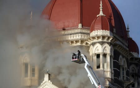 Firefighters try to douse a fire at the Taj Mahal Hotel in Mumbai