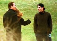 <p>John F. Kennedy Jr. and Arnold Schwarzenegger talk at the Kennedy family compound in Hyannis Port, Mass. in 1995.</p>