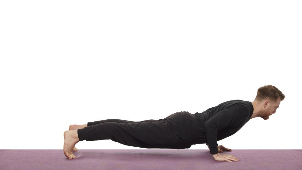 Yoga teacher Nick Higgins performs Vinyasa
