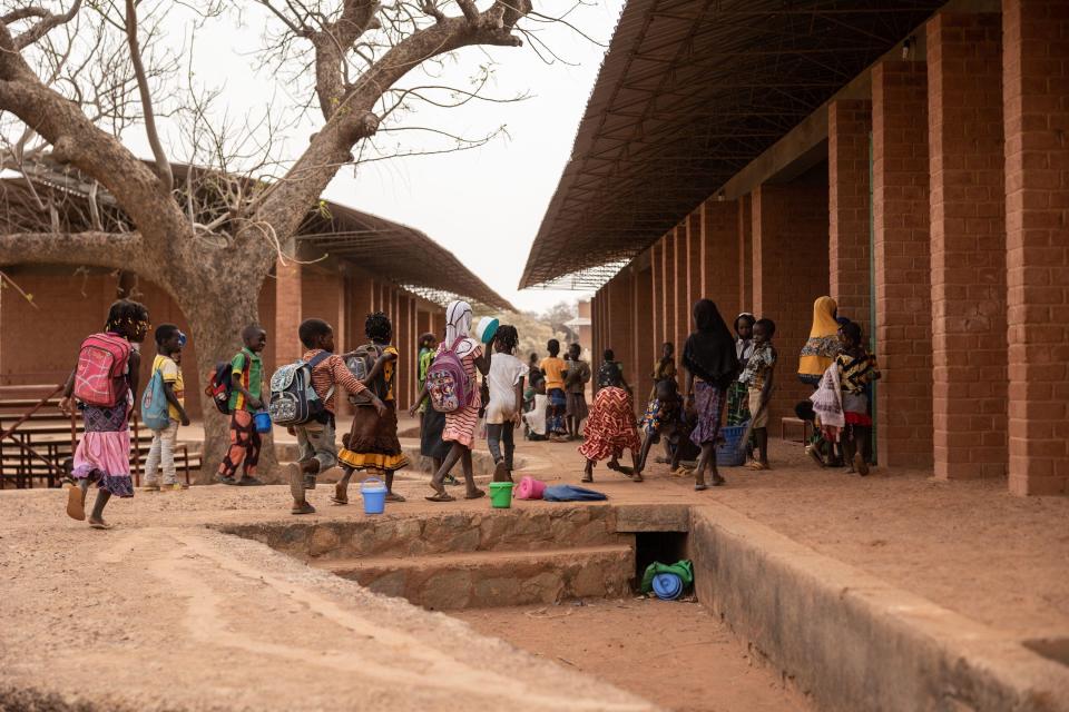 Schoolchildren play at the Village-Opera school, designed by Architect Diebedo Francis Kere, in Laongo, on March 16, 2022.