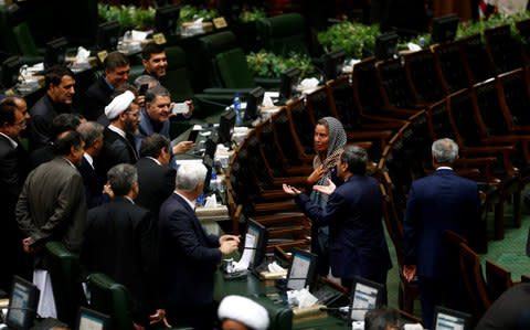 Discussions emerged at the Iranian Parliament after Iranian Deputies' effort to take selfies with Ms Mogherini - Credit: Stringer/Anadolu Agency/Getty Images