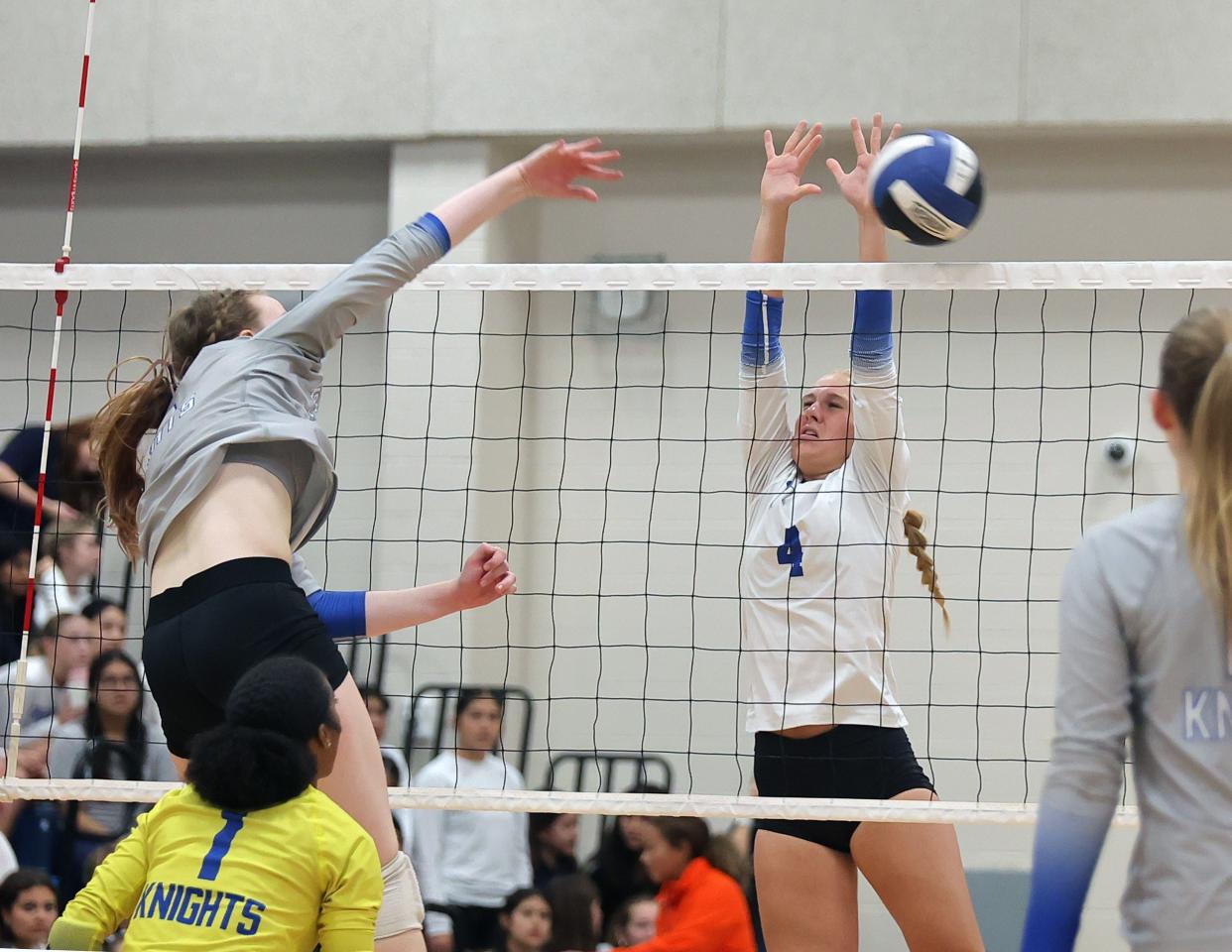 McCallum middle blocker Greta Carlson tries to stop a shot against Ann Richards during their district game on Oct. 24, 2023. Carlson has led McCallum to consecutive district championships.