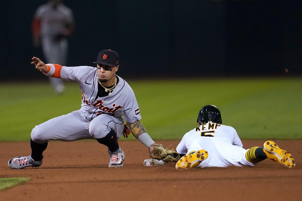 Oakland Athletics' Tony Kemp, right, is tagged out trying to steal second base by Detroit Tigers shortstop Javier Baez during the fourth inning at Oakland Coliseum in Oakland, California, on Friday, Sept. 22, 2023.