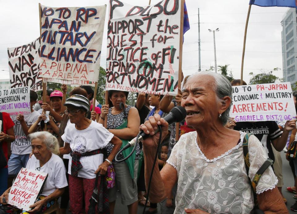 Alleged Filipino "comfort woman" Narcisa Claveria, 87, addresses supporters during a rally outside the Japanese Embassy to protest the two-day visit of Japanese Prime Minister Shinzo Abe, Thursday, Jan. 12, 2017, in suburban Pasay city south of Manila, Philippines. The "comfort women," allegedly forced by Japanese forces to be sex slaves during WWII, are calling on President Rodrigo Duterte to bring up their plight in his meeting with Prime Minister Abe. (AP Photo/Bullit Marquez)