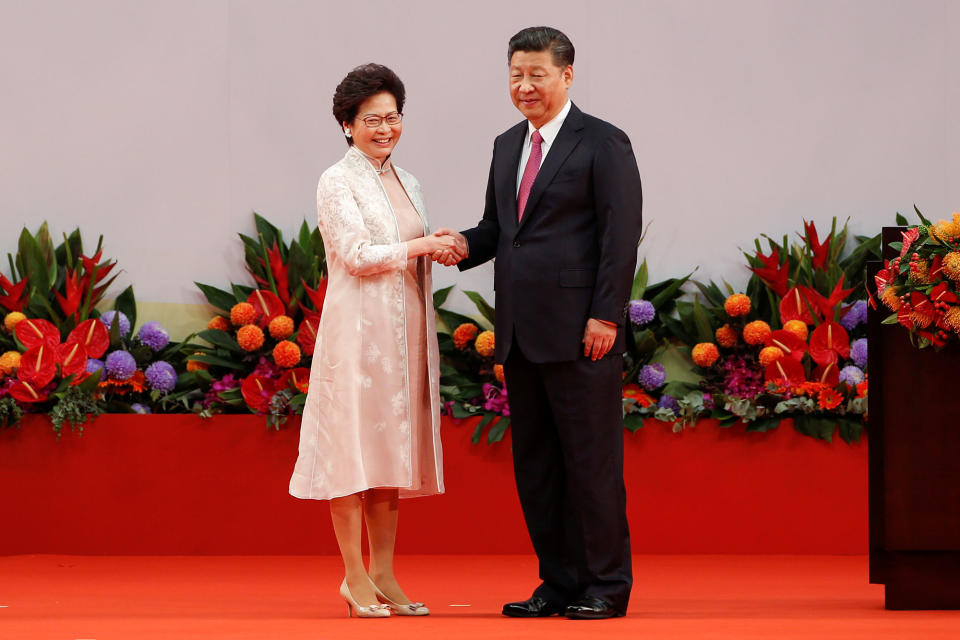 <p>Hong Kong Chief Executive Carrie Lam shakes hands with Chinese President Xi Jinping after she swore an oath of office on the 20th anniversary of the city’s handover from British to Chinese rule, in Hong Kong, China, July 1, 2017. (Photo: Bobby Yip/Reuters) </p>