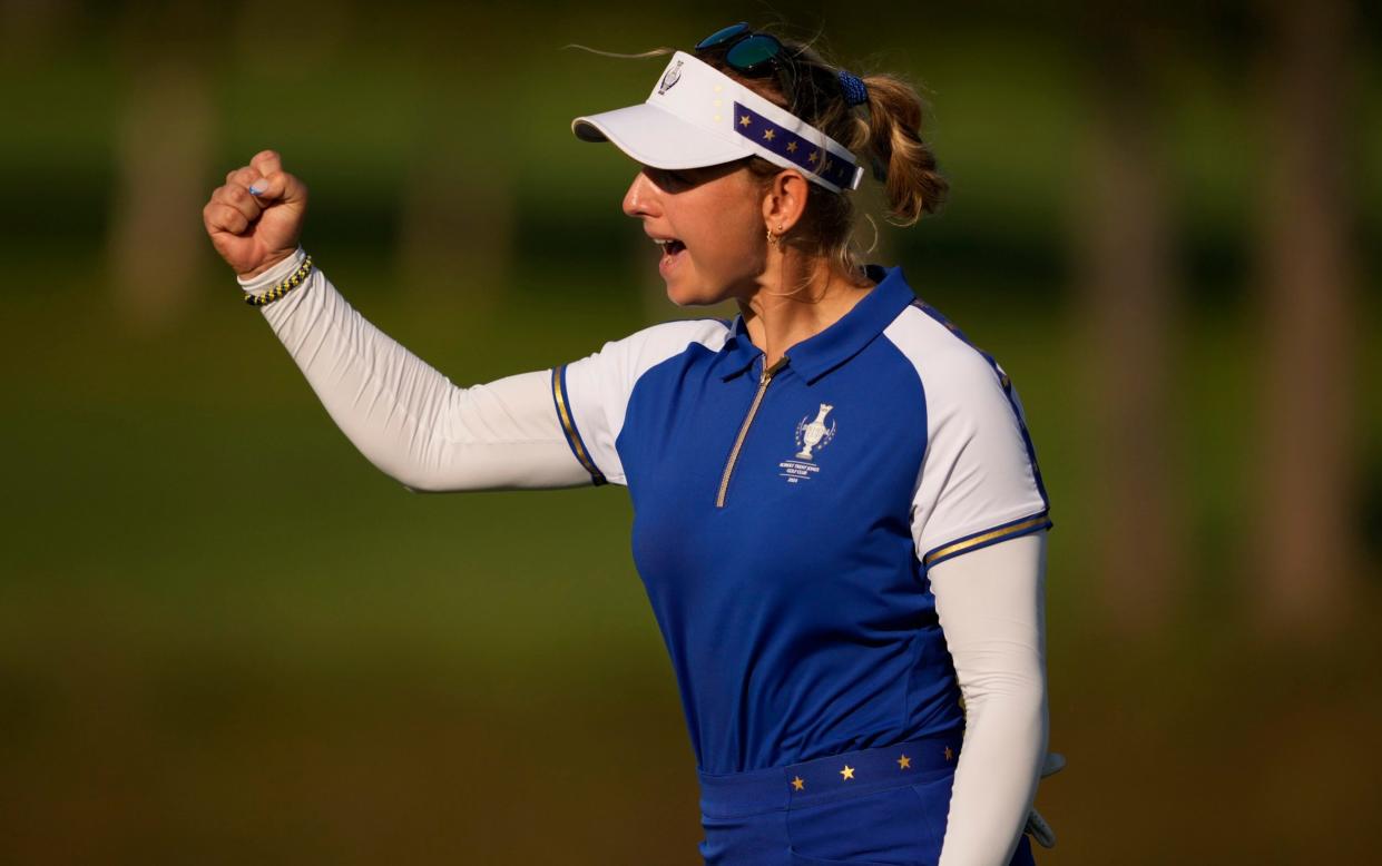 Emily Pedersen celebrates after making a putt