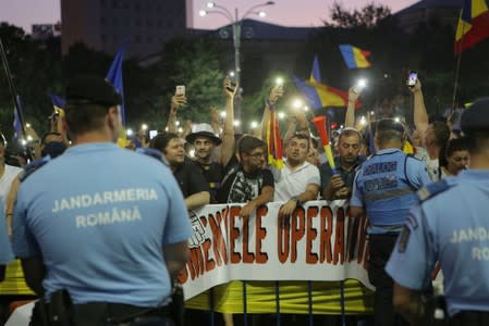 Thousands of people protest against the Romanian government in central Bucharest