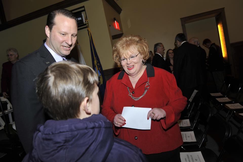 Lansing City Council president Carol Wood talks to people before Lansing Mayor Virg Bernero's "Lansing Powered Up!" state of the city address at the restored former railroad station at the new BWL REO Town Cogeneration facility in Lansing Monday 1/28/2013. (Lansing State Journal | Rod Sanford)