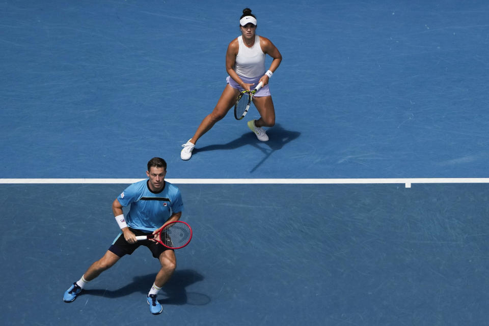 Desirae Krawczyk of the U.S. and Neal Skupski, left, of Britain in action against Hsieh Su-Wei of Taiwan and Jan Zielinski of Poland during the mixed doubles final at the Australian Open tennis championships at Melbourne Park, Melbourne, Australia, Friday, Jan. 26, 2024. (AP Photo/Louise Delmotte)