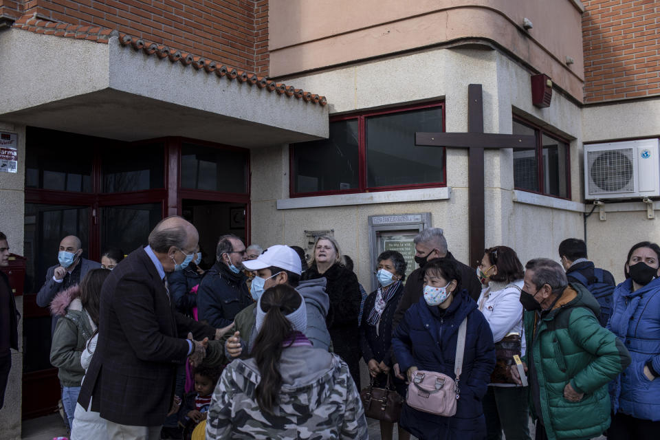 Kent Albright, a Baptist pastor from the United States, talks to parishioners after Sunday Mass at his evangelical church in Santa Marta de Tormes, outskirts of Salamanca, Spain, Dec. 5, 2021. In a Ph.D thesis, Albright estimated that 20% of the migrants into Spain are evangelicals. (AP Photo/Manu Brabo)