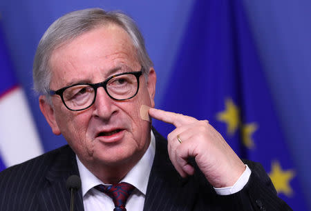 European Commission President Jean-Claude Juncker shows a bandage after his shaving injury, at the EC headquarters in Brussels, Belgium February 20, 2019. REUTERS/Yves Herman