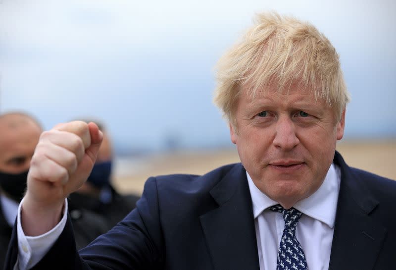 FILE PHOTO: Britain's Prime Minister Boris Johnson gestures as he campaigns on behalf of Conservative Party candidate Jill Mortimer in Hartlepool