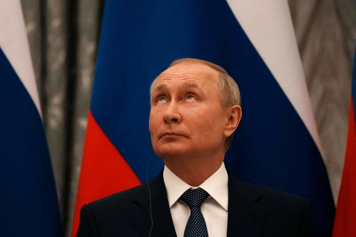 TOPSHOT - Russian President Vladimir Putin looks on during a press conference after meeting with French President in Moscow, on February 7, 2022. - International efforts to defuse the standoff over Ukraine intensified with French President holding talks in Moscow and German Chancellor in Washington to coordinate policies as fears of a Russian invasion mount. (Photo by Thibault Camus / POOL / AFP) (Photo by THIBAULT CAMUS/POOL/AFP via Getty Images)