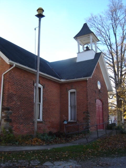 A dedication of a new playground was held at Rowsburg School in 1922. This is a photo of the school in 2013.