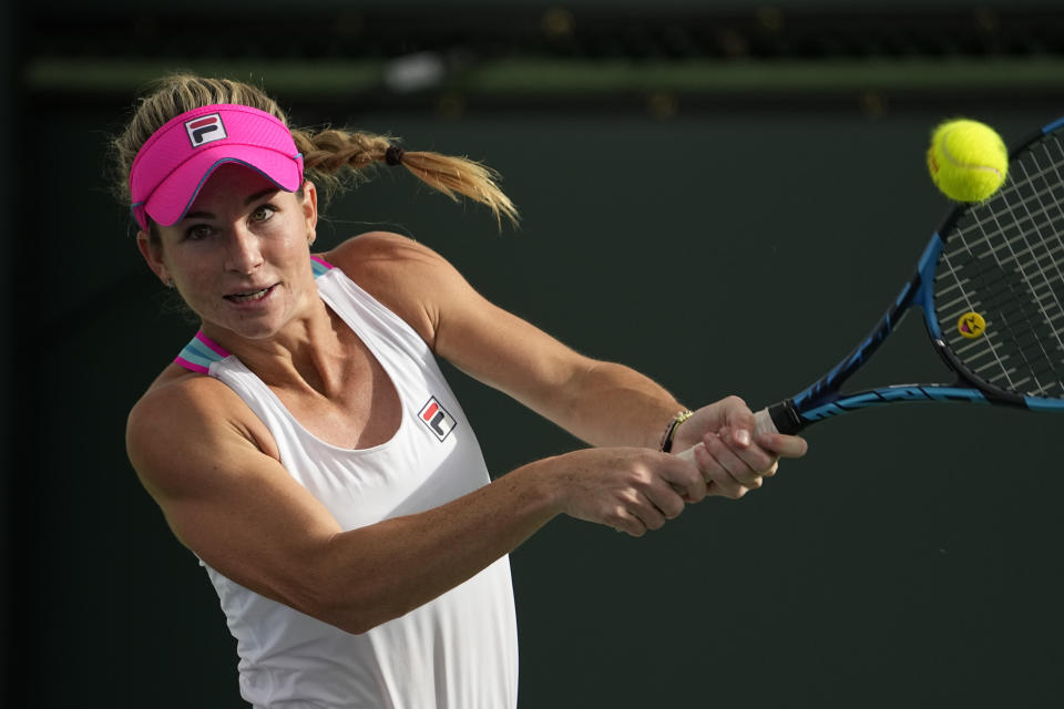 Elizabeth Mandlik returns a shot to Petra Kvitova, of the Czech Republic, at the BNP Paribas Open tennis tournament Friday, March 10, 2023, in Indian Wells, Calif. (AP Photo/Mark J. Terrill)