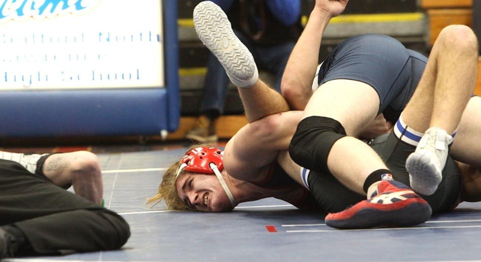 BNL senior Gunner Connaughton locks Columbus North's Bryce Abner in a cradle to get a pin at 195 pounds Thursday on Senior Night at BNL Fieldhouse.