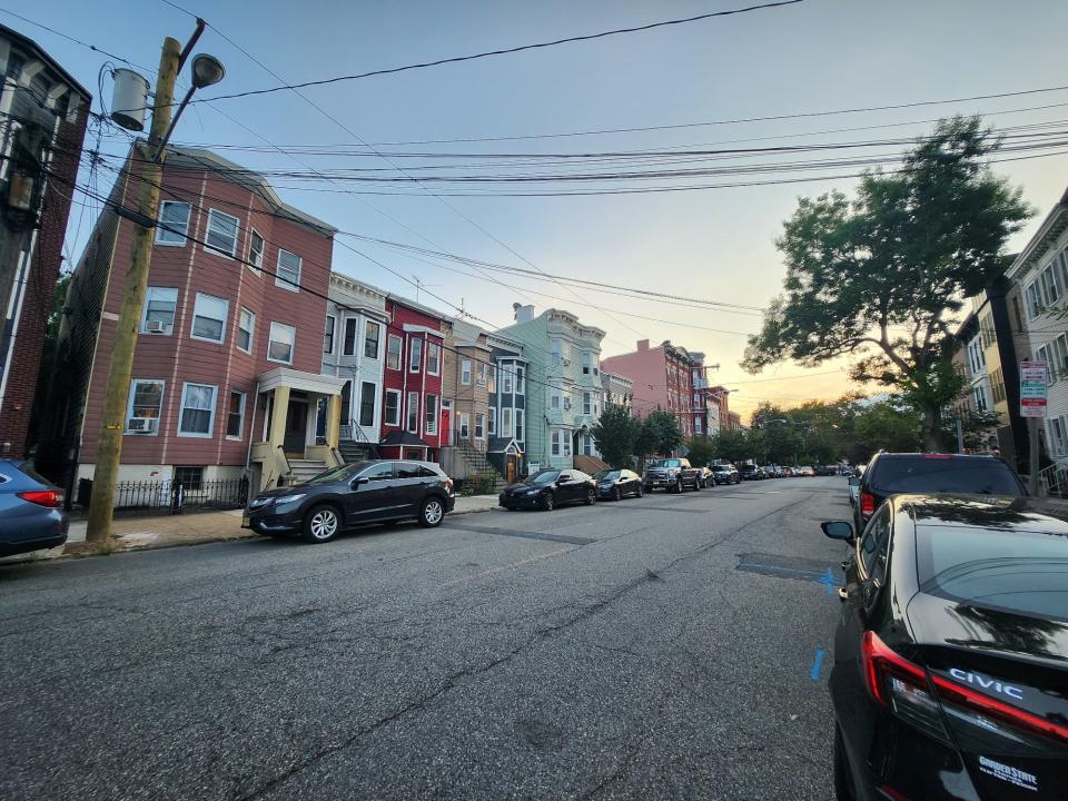 <p>A picture taken with the Galaxy Z Flip 4 showing a wide angle view of a row of buildings at sunset.</p>
