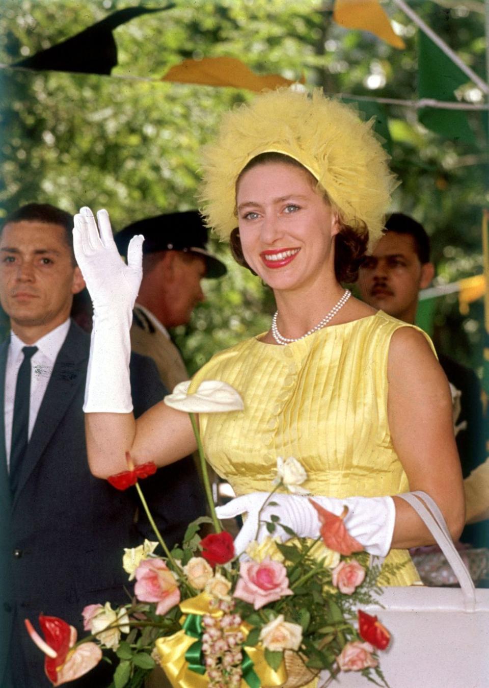 <p>Princess Margaret waves to the crowd during a visit to Jamaica. Here, she's attending a ceremony marking the independence of the former British colonies on August 8, 1962 in Jamaica.</p>