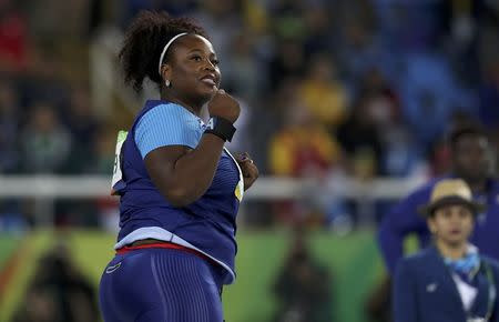 2016 Rio Olympics - Athletics - Final - Women's Shot Put Final - Olympic Stadium - Rio de Janeiro, Brazil - 12/08/2016. Michelle Carter (USA) of USA celebrates after winning the gold medal in the women's shot put. REUTERS/Phil Noble