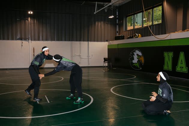 Jamilah and Latifah McBryde demonstrate wrestling drills at Life University while their sister Zaynah waits her turn, April 13, 2023.